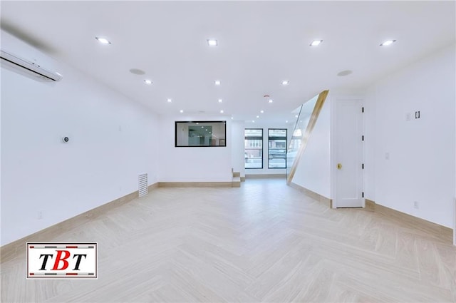 unfurnished living room with light parquet floors and a wall mounted AC