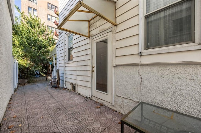 view of property exterior with a patio