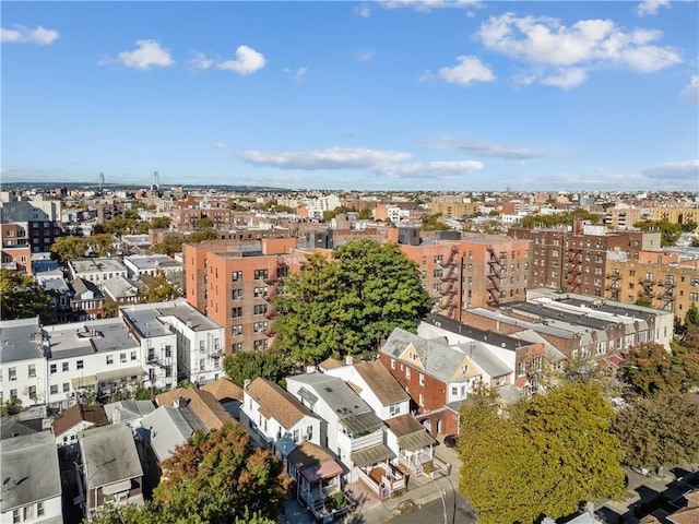 birds eye view of property with a view of city