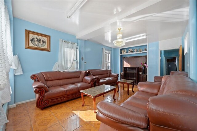 living room featuring beamed ceiling