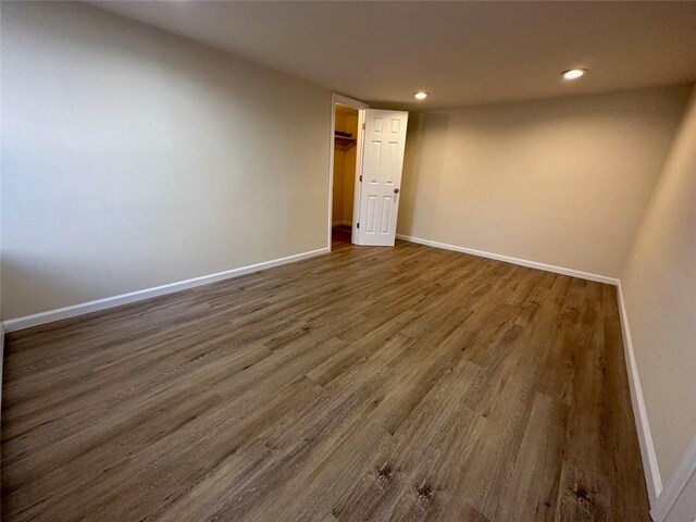 spare room with dark wood-type flooring