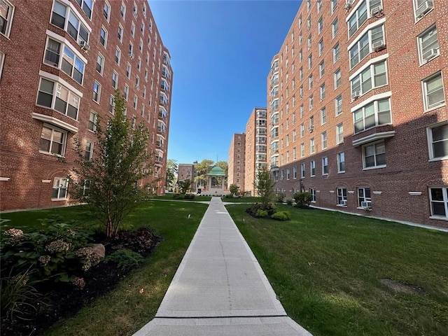 view of home's community with a lawn