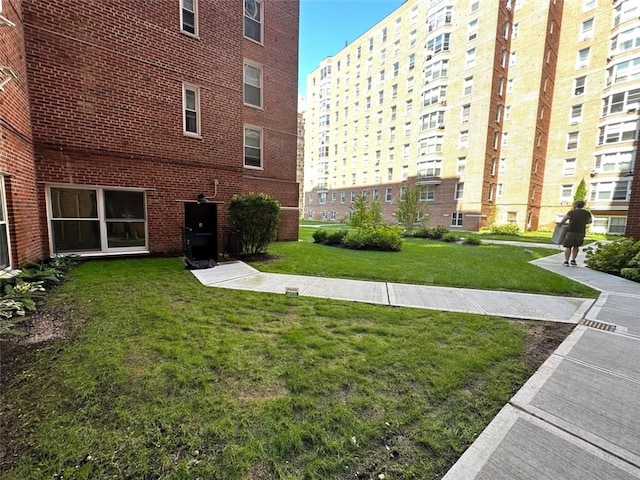 view of home's community featuring a yard