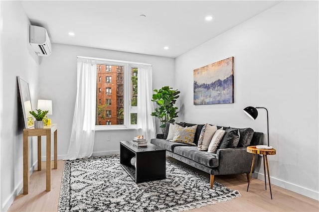 living room featuring hardwood / wood-style floors and a wall unit AC