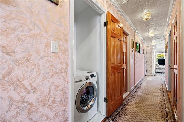 clothes washing area featuring washer / clothes dryer, a textured ceiling, crown molding, and wallpapered walls