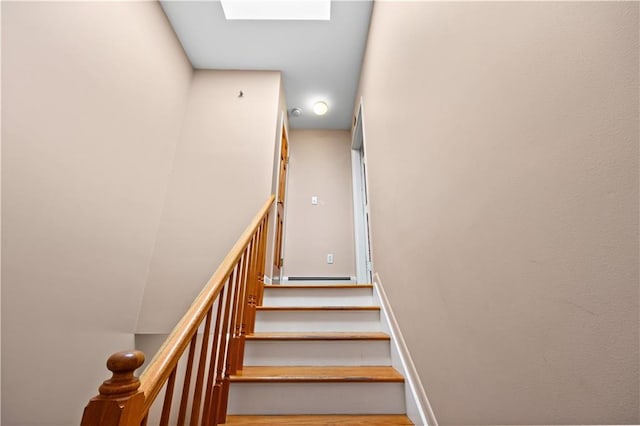 staircase with a skylight