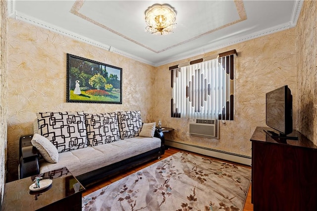 living room with crown molding, cooling unit, wood finished floors, and a baseboard radiator