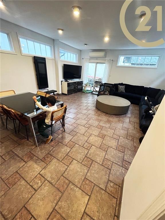 living room featuring a wall mounted air conditioner