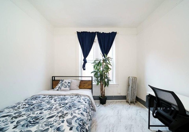 bedroom with light hardwood / wood-style floors