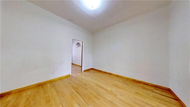 spare room featuring hardwood / wood-style floors