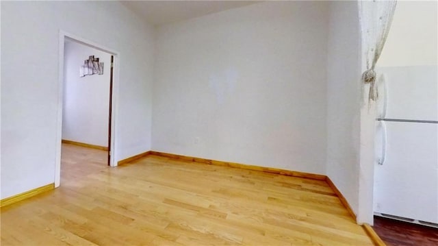 unfurnished room with light hardwood / wood-style flooring