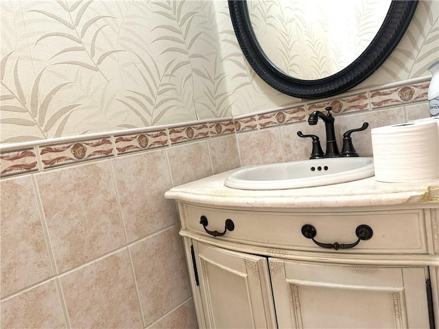 bathroom featuring tile walls and vanity