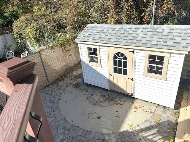 view of shed with a fenced backyard