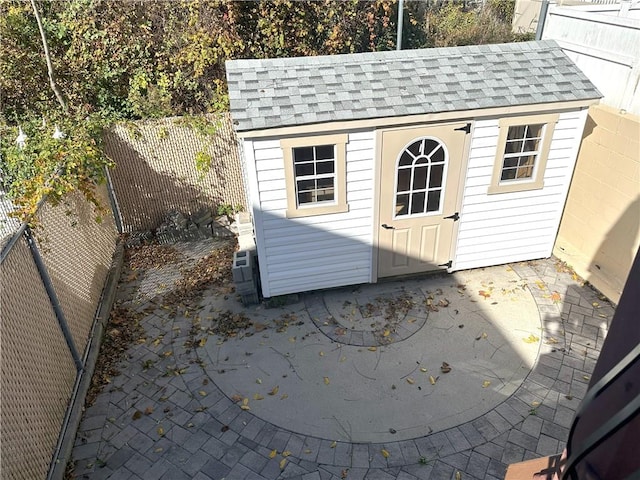 view of shed featuring a fenced backyard