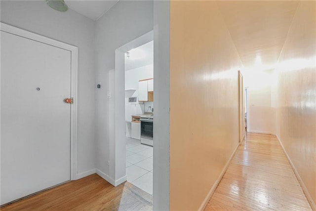 corridor featuring light hardwood / wood-style flooring