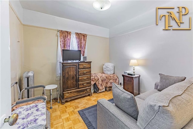 sitting room featuring light parquet flooring and radiator