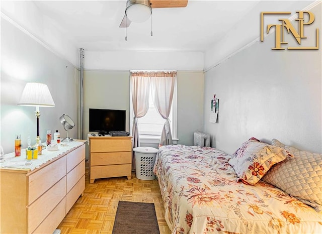 bedroom featuring ceiling fan and light parquet flooring