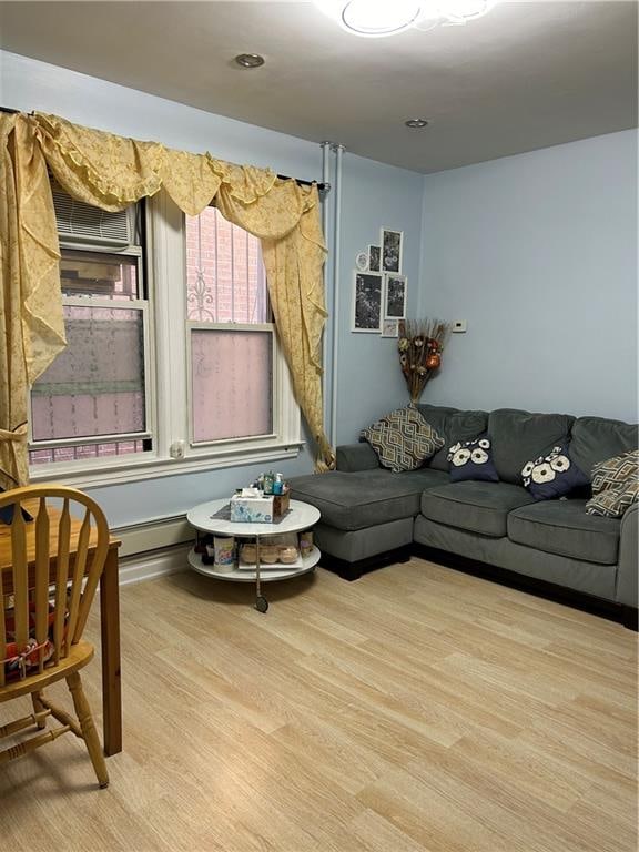 living room with light hardwood / wood-style flooring