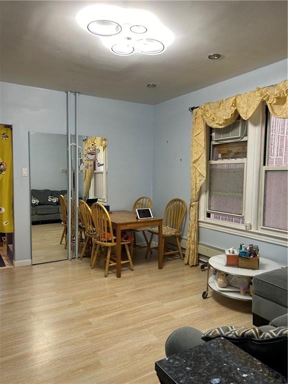 dining area with hardwood / wood-style flooring