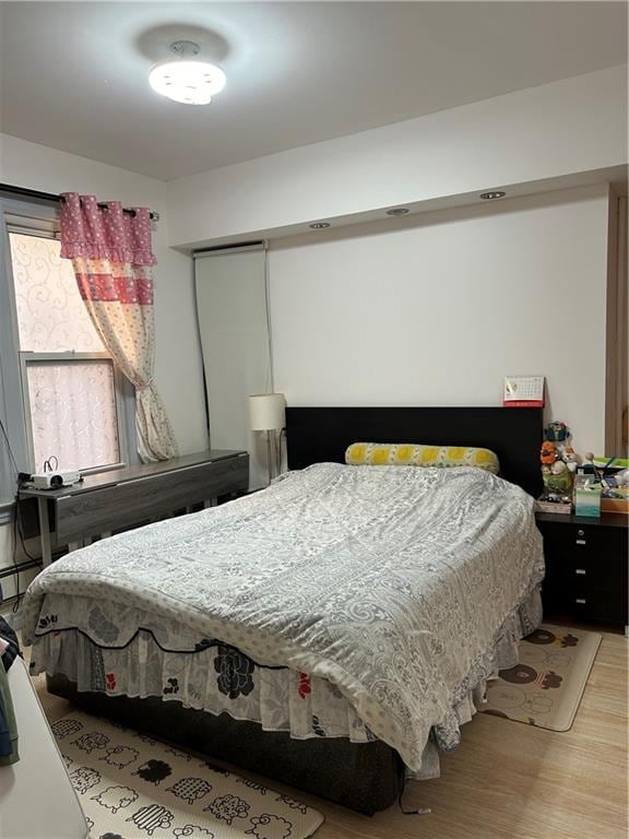 bedroom featuring light wood-type flooring