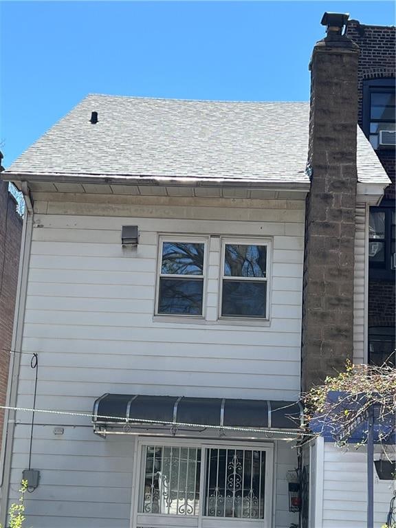 exterior space featuring a chimney