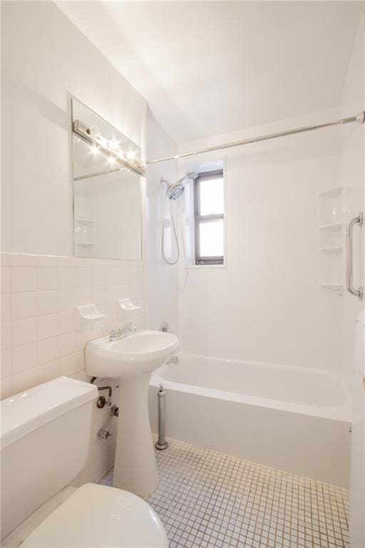 15 Oliver St Unit 4C, Brooklyn, NY 11209 - full bath with toilet, tile walls, shower / tub combination, and tile patterned floors
