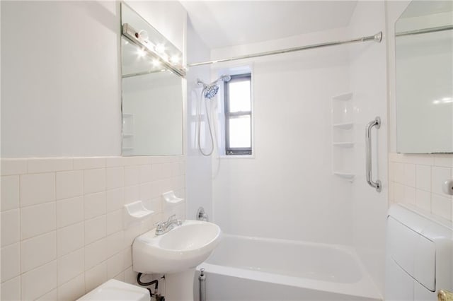 15 Oliver St Unit 4C, Brooklyn, NY 11209 - bathroom featuring shower / bath combination, toilet, a sink, tile walls, and tasteful backsplash