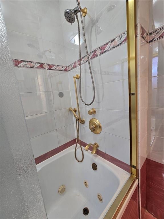 bathroom with a combined bath / shower with jetted tub