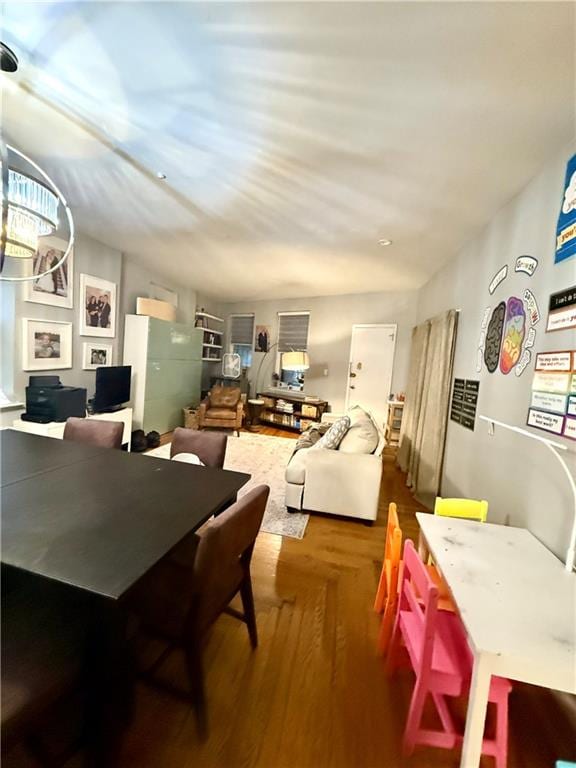 dining space with wood finished floors