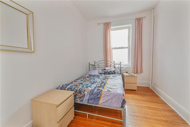 bedroom with light hardwood / wood-style floors