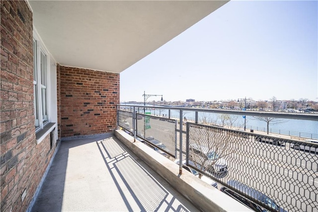 balcony featuring a water view