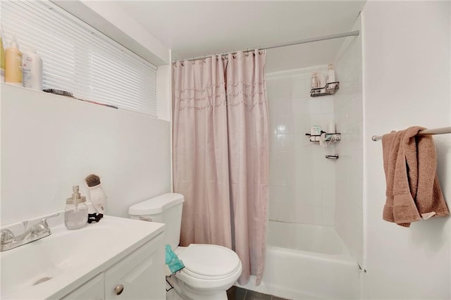 full bathroom featuring vanity, shower / tub combo, and toilet