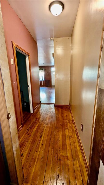 hall with dark hardwood / wood-style floors