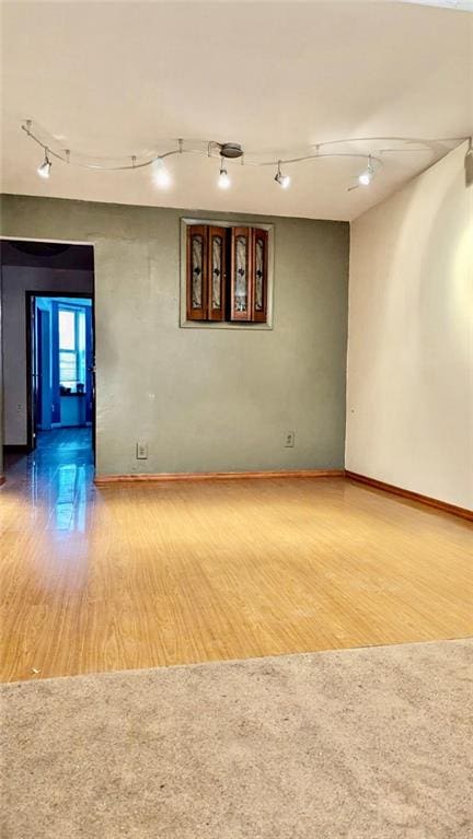 empty room with wood-type flooring