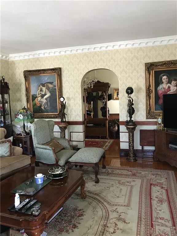 living area with hardwood / wood-style floors