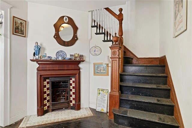 stairs featuring wood-type flooring