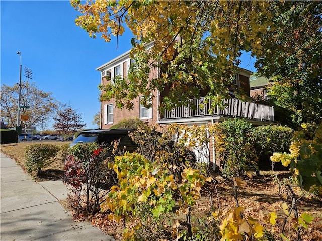 view of property exterior with a balcony