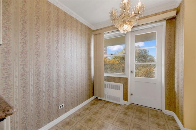 doorway to outside with a notable chandelier, baseboards, wallpapered walls, radiator heating unit, and crown molding