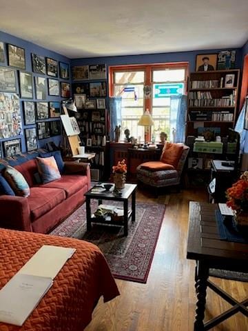 living area with hardwood / wood-style flooring