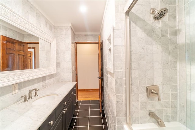 bathroom featuring walk in shower, vanity, tile patterned floors, and tile walls