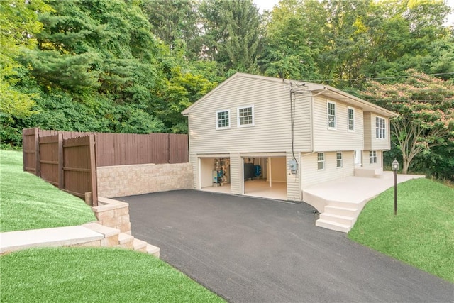 view of property exterior with a lawn