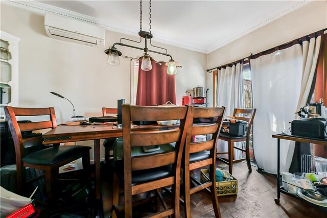 dining room with ornamental molding and a wall unit AC