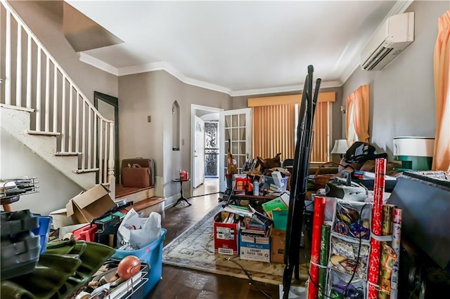 miscellaneous room with french doors, a wall mounted air conditioner, crown molding, and dark hardwood / wood-style flooring