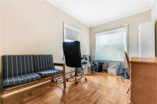 interior space with ornamental molding and light parquet flooring