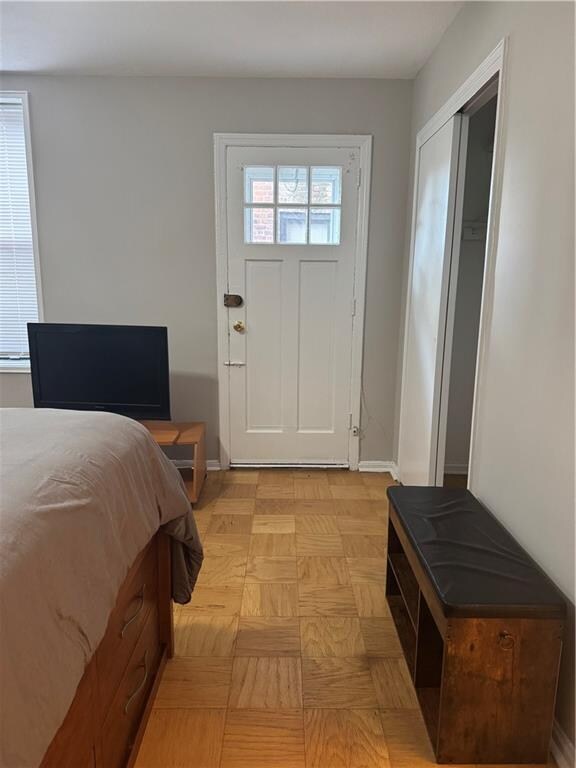 bedroom with ceiling fan, cooling unit, and a textured ceiling