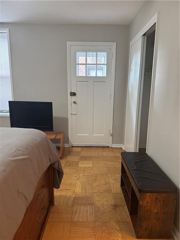 bedroom featuring light parquet flooring