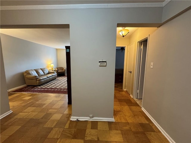 hall with crown molding and parquet floors