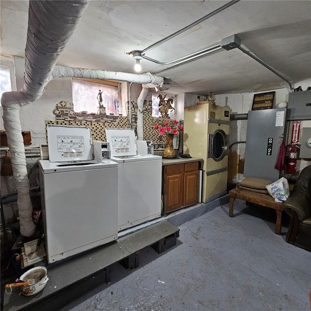 below grade area featuring washer and clothes dryer