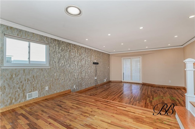 spare room with ornamental molding, recessed lighting, visible vents, and decorative columns