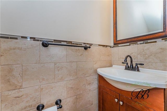 bathroom with a wainscoted wall and vanity